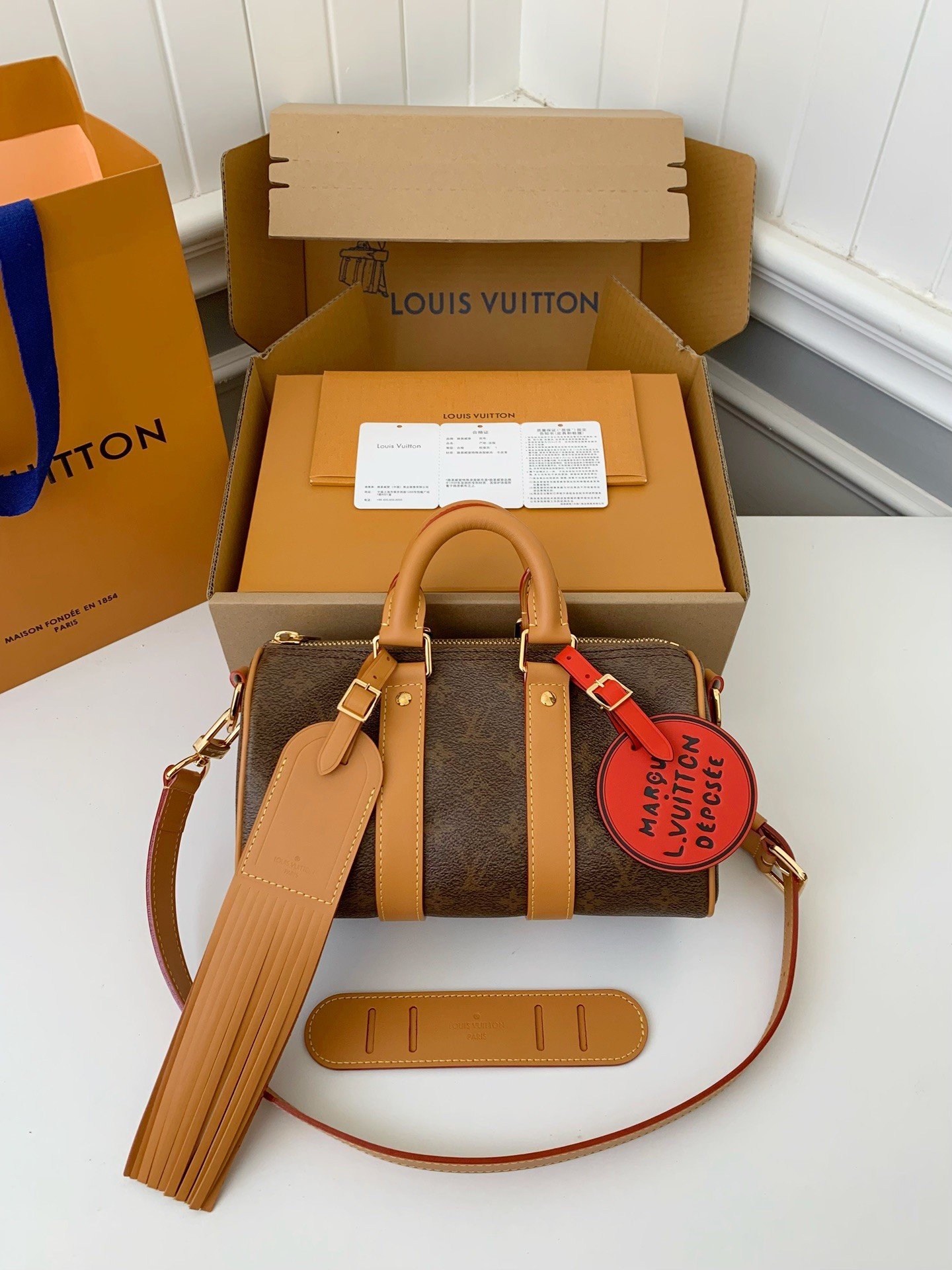 L X V The New Keepall Bandouli ère 25 handbag  M11542  Size：25*15*11cm